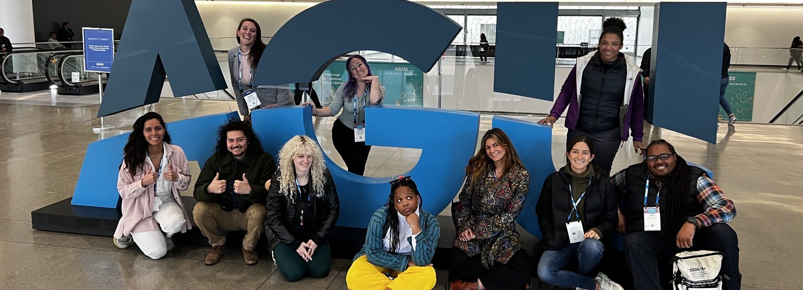 
		2023 Affiliates posing in front of large blue letters spelling out 